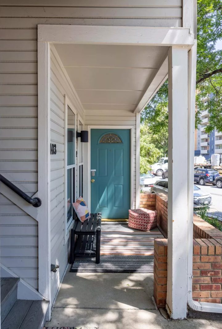 Teal Door on a Covered Apartment Porch