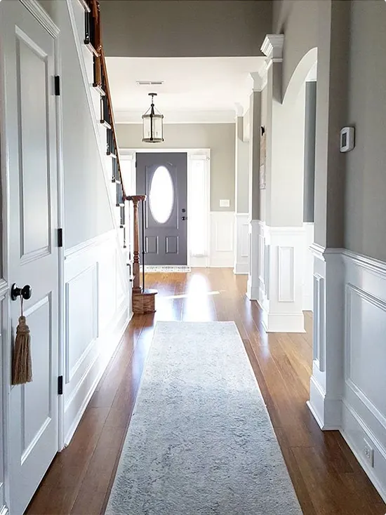 White and Gray Wainscoted Hallway