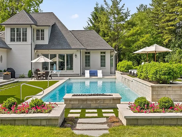 White Rectangular Pool, Pink and Red Raised Stone Flower Beds, and Stone Stepping Pads