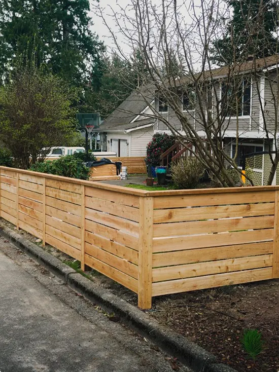 Fresh Horizontal Cedar Fence Along a Sidewalk