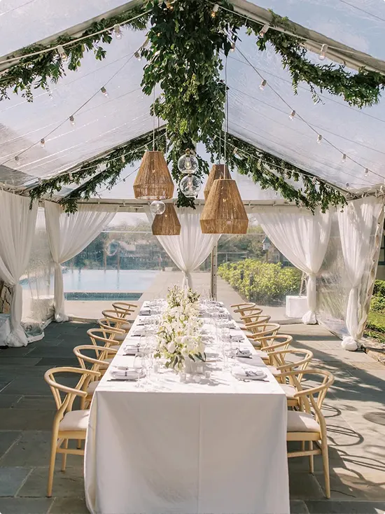 Rattan pendant in a clear garden tent