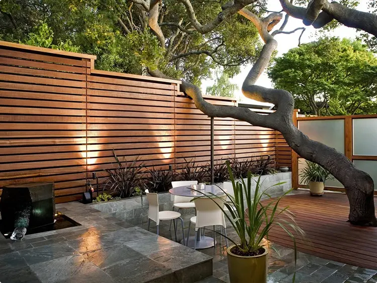 Warm Horizontal Teak Fence with Warm Patio Uplighting