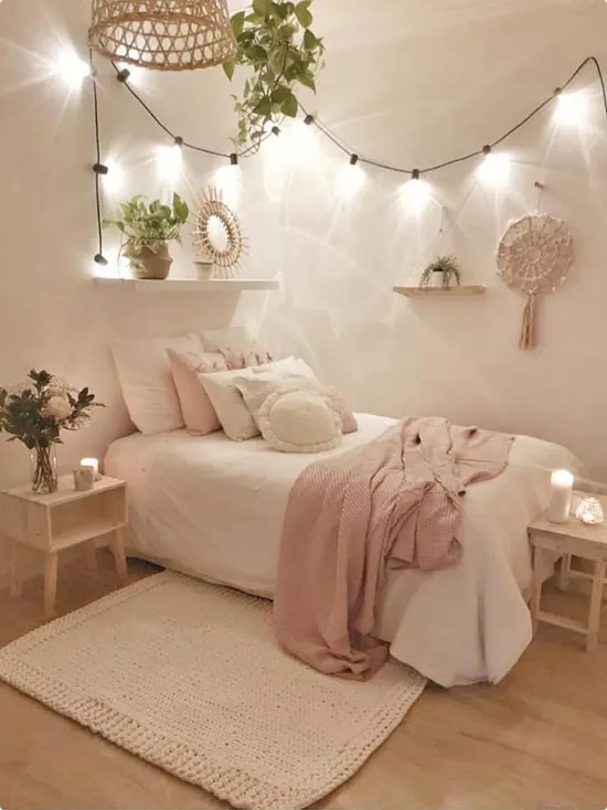 Arc string lights with a small shelf mirror and woven dream catcher