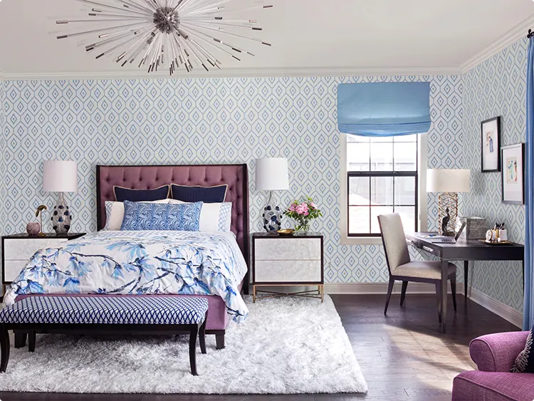 Blue ikat walls and a purple velvet headboard