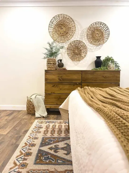 Four Round Woven Baskets Above a Dark Wood Dresser