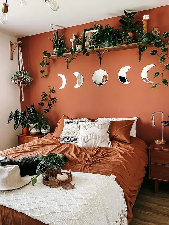 Moon Phase Mirrors Against a Burnt Orange Wall