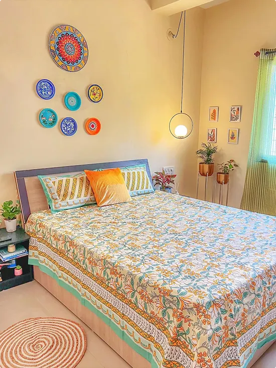 Painted Decorative Plates on a Warm Yellow Wall
