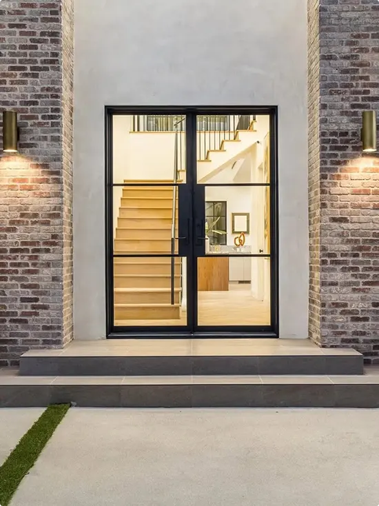 Black French Doors with a Warm Night Glow