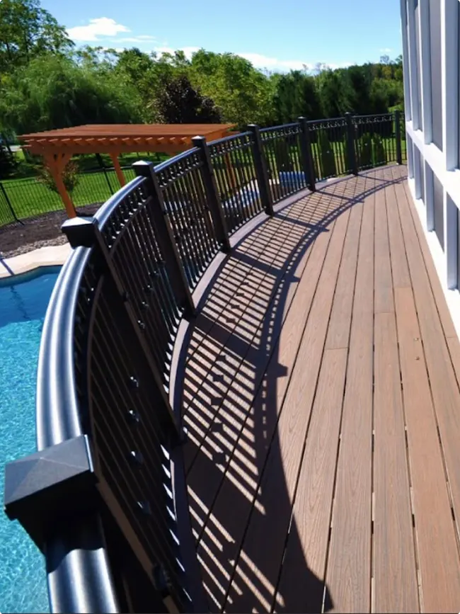 Curved Deck at Pool Perimeter with Background Pergola