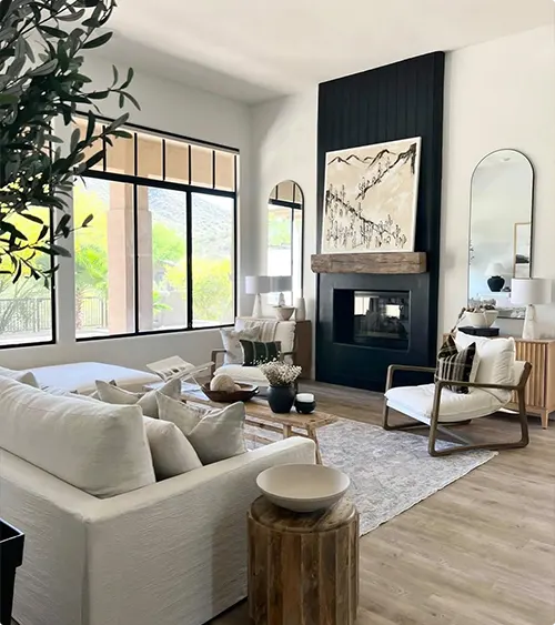 Floor-to-Ceiling Vertical Black Wall With Wood Mantel