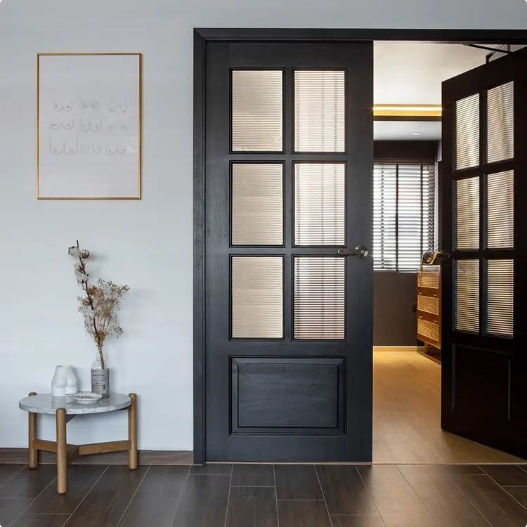 Gold Wall Art Beside a Black Interior French Door