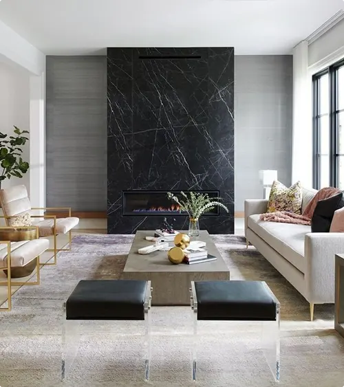 Gray panels beside a black marble fireplace wall