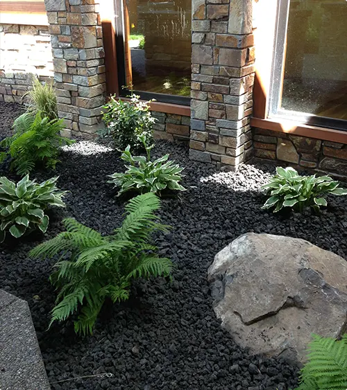 Stone Planter Bed with Stacked Columns