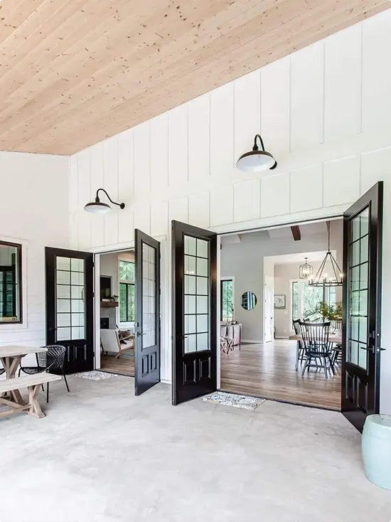 The farmhouse hallway's double French doors