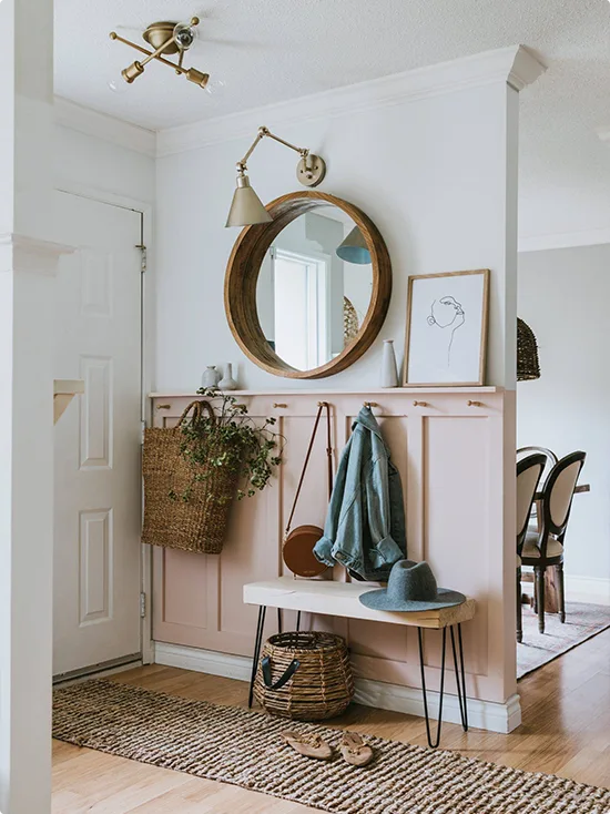 Blush Pink Entryway Cabinets with a Round Mirror