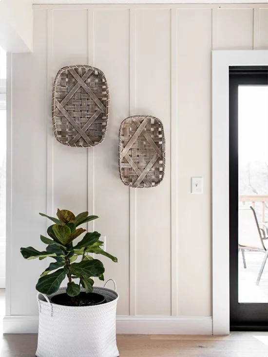 Cream Wall with Two Woven Tobacco Baskets