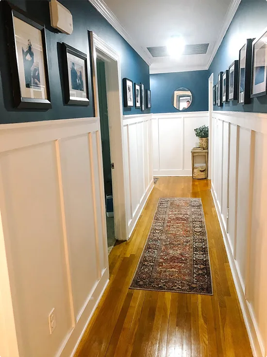 Gallery Hallway with White Board and Batten and Deep Teal Walls