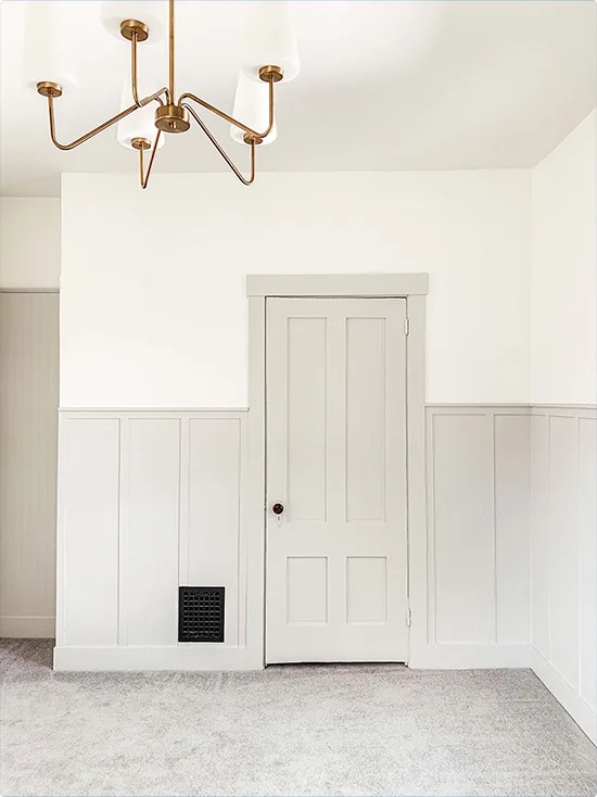 Gold Chandelier Over Soft White Board and Batten