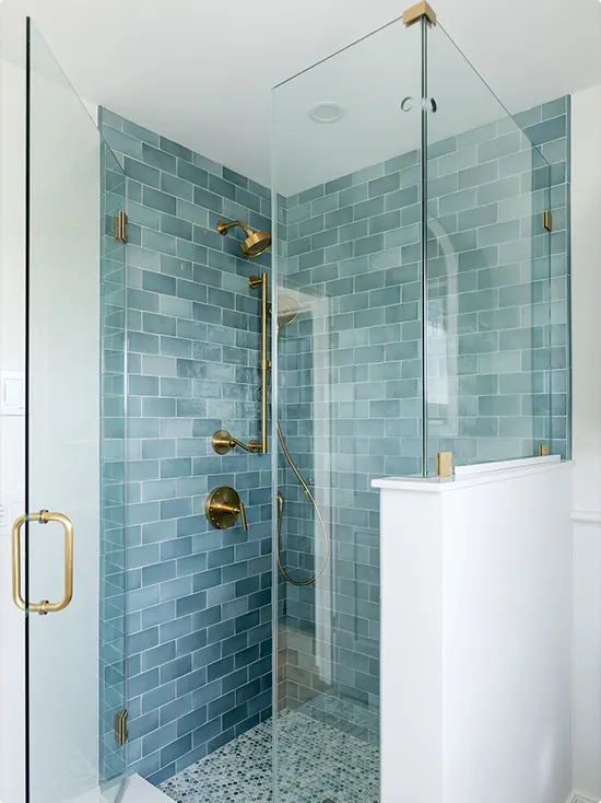 Gold Fixtures in a Dusty Blue Shower