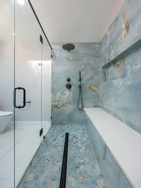 Light Blue Marble Shower with a Long Built-In Bench