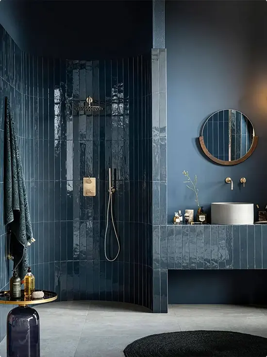 Moody Lighting and Vertical Deep Teal-Blue Tile