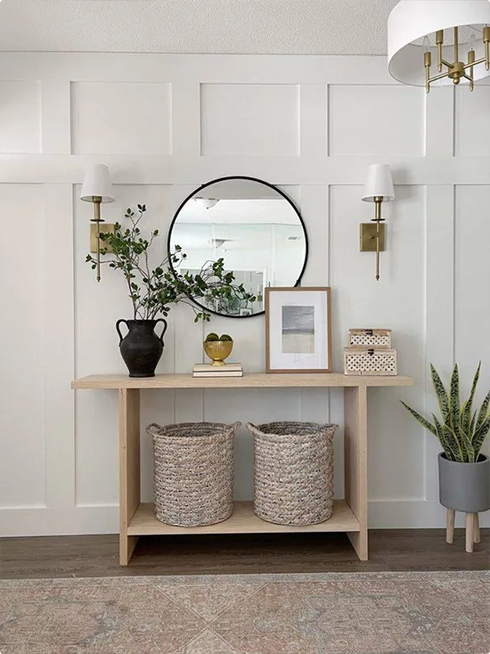 Round Black Mirror with White Full-Height Board-and-Batten Wall