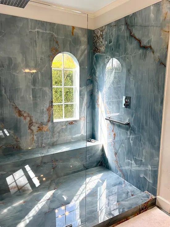 Shower with Blue Onyx and Arched Windows