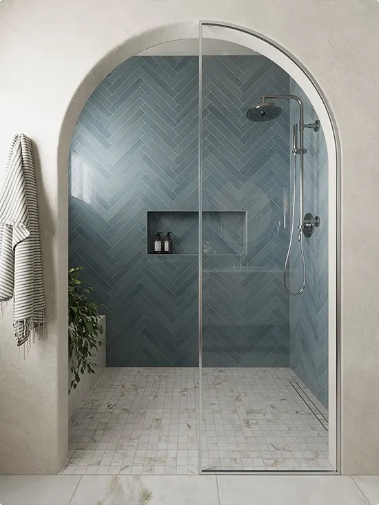 Slate Blue Herringbone Tile Inside a Shower Arch