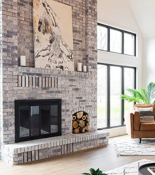 Brick Fireplace in Gray with Firewood Storage Built In