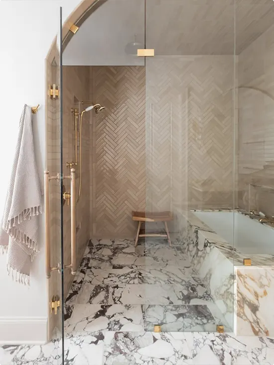 Brown Herringbone Tile and Marble Shower