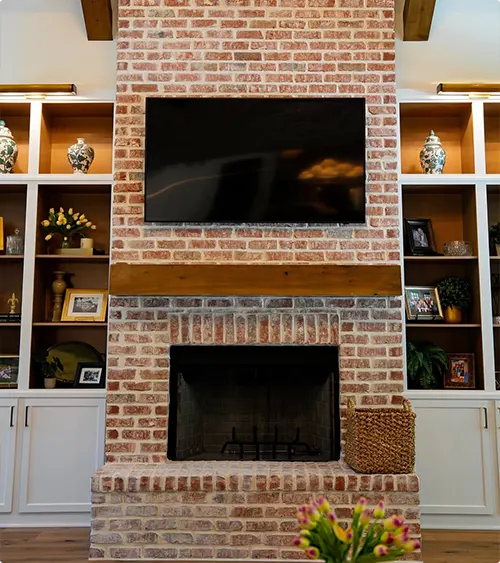 Built-In Shelving Around a Brick Fireplace