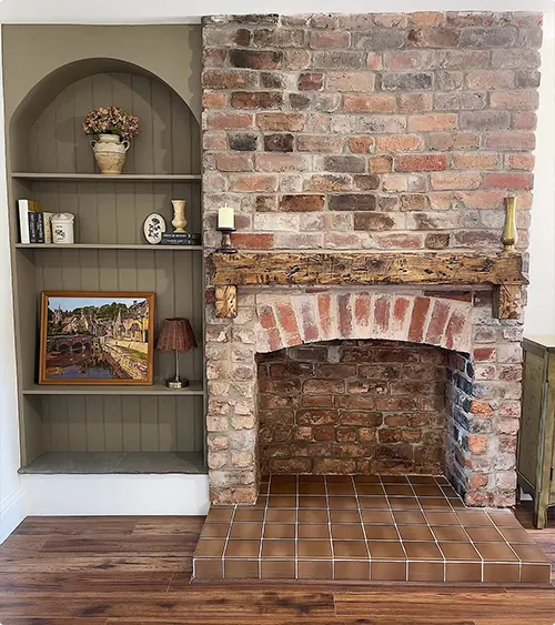 Built-In Soft Green Nook Beside Rustic Brick Fireplace