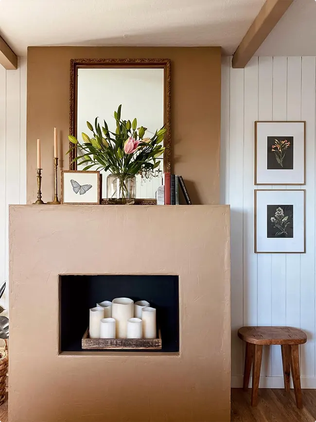 Fresh flowers on an earth-tone fireplace