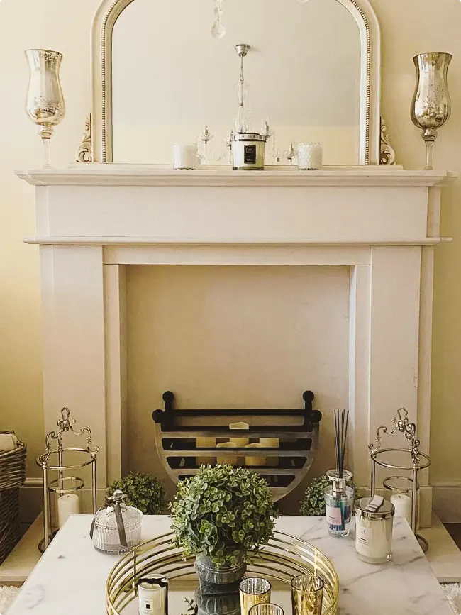 Softly Symmetrical Fireplace Styling with Hurricane Lamps