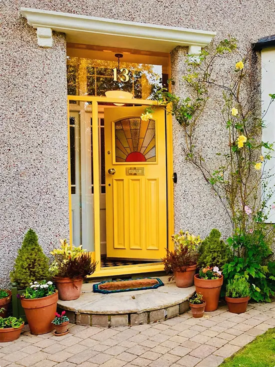 Sunburst Stained Glass on a Yellow Front Door
