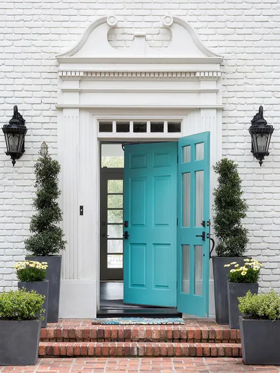 White Brick Estate and Turquoise Double Door