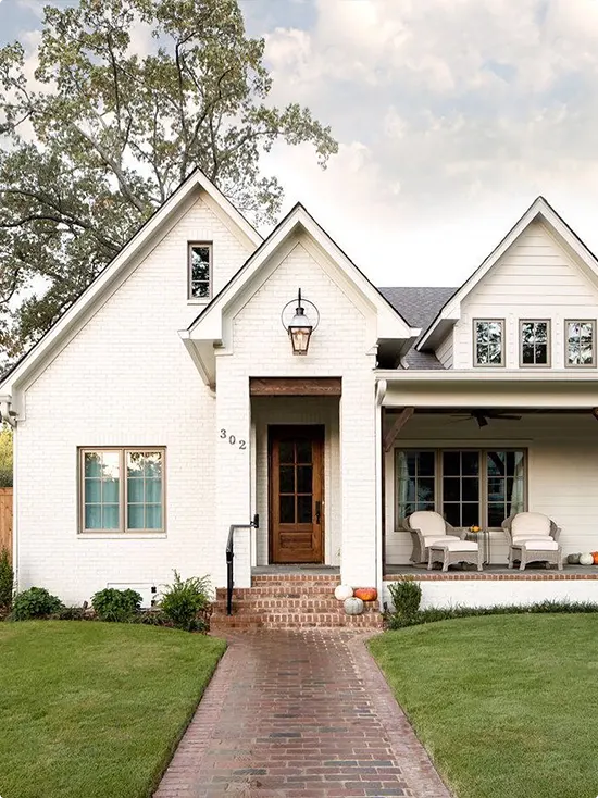 White Farmhouse Door with Brick Walkway