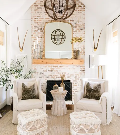 Whitewashed Brick Fireplace with an Arched Mirror Above the Mantel