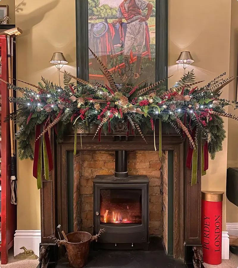 Berries and Feathers on a Traditional Woodland Christmas Swag