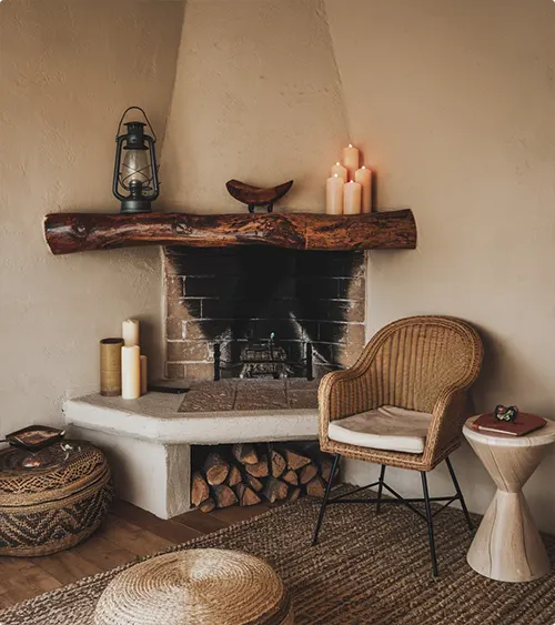 Corner Fireplace with Driftwood Mantel in a Desert Cottage