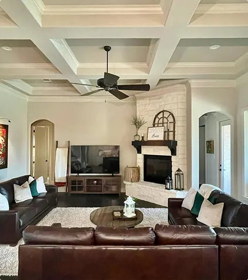 Leather Sectionals Under a Coffered Ceiling