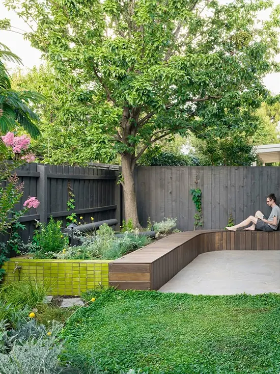 Long Timber Bench L-Shaped by Chartreuse Tile-Faced Planter Wall