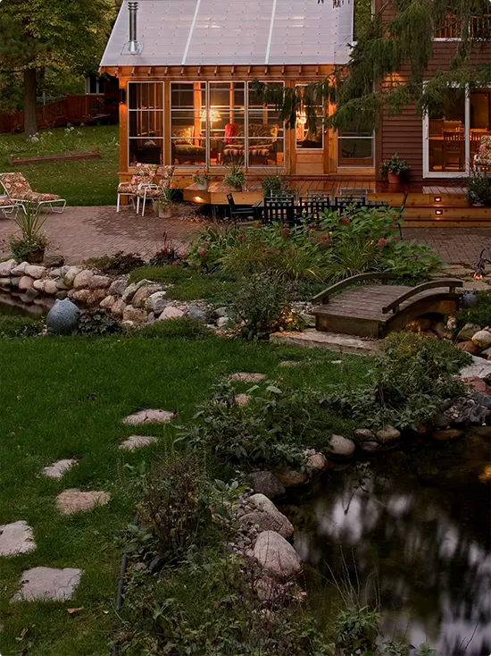Small Arched Bridge to the Pond at Twilight