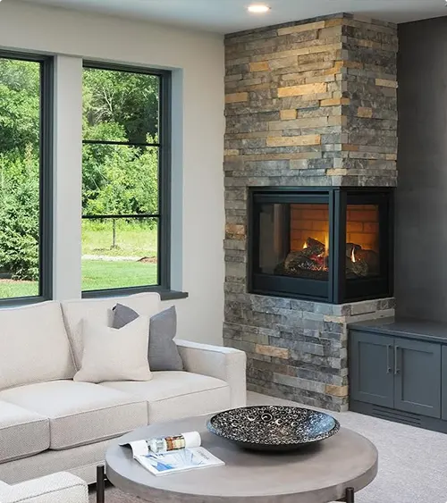 Three-Sided Glass Fireplace with Stacked Wood Stone and Window Seat