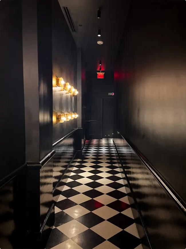 Glossy Black Checkered Hallway