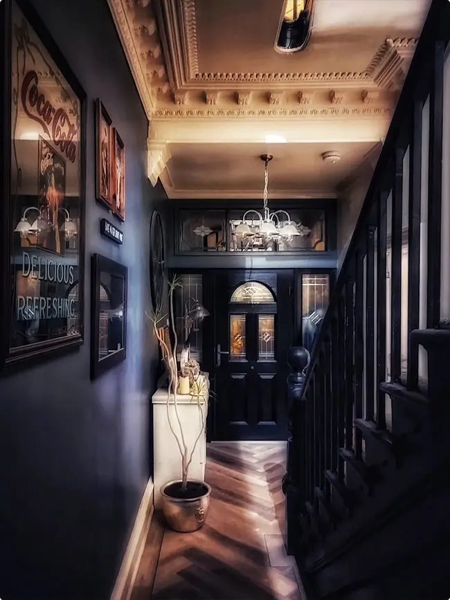 Gold Accents in a Deep Navy Hallway