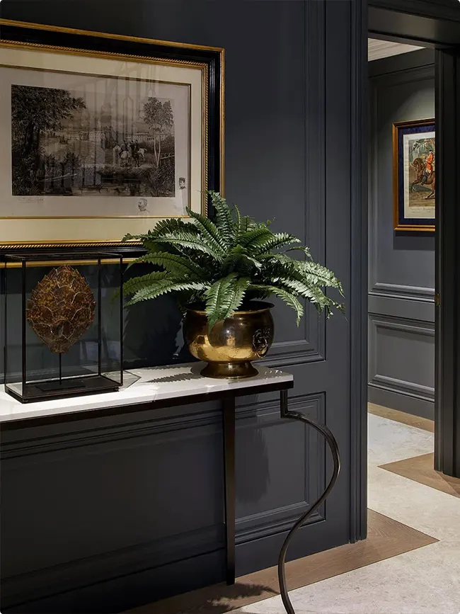 Gold-Framed Art on a Charcoal Wall