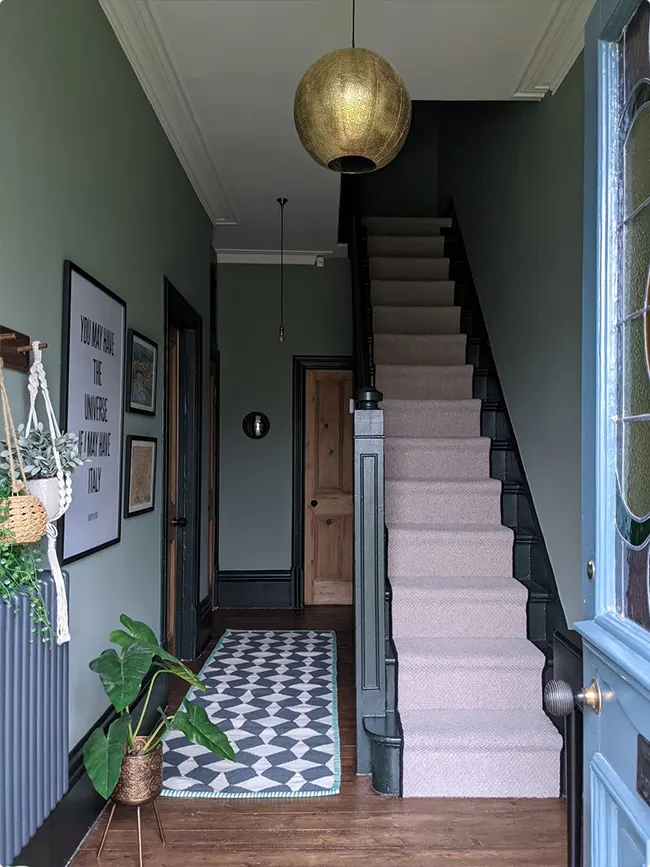 Moody Sage Green Hallway with an Oversized Gold Pendant