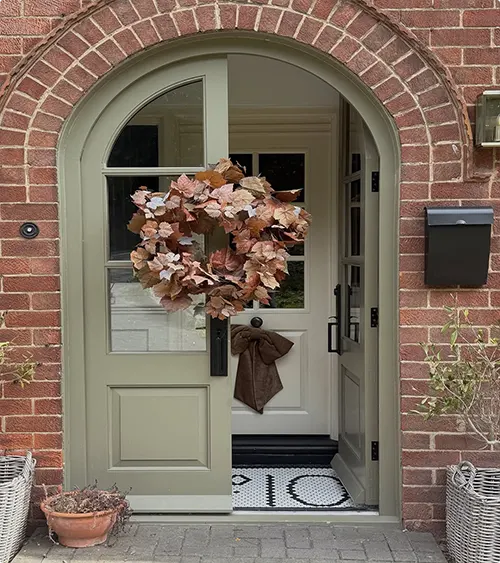 Sage Green Double Doors with a Fall Wreath