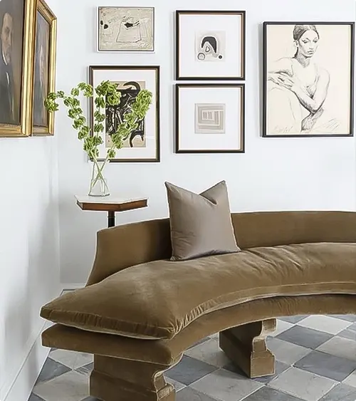 Curved bench and gallery wall in the corner